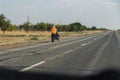 An elderly traveler with a cart under the pseudonym Ulytaumen travels around Kazakhstan on foot. Royalty Free Stock Photo