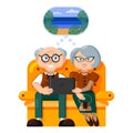 Elderly travelers. Beautiful elderly couple dream of traveling, planning a sea vacation, choosing a resort on the Internet