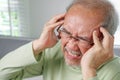Elderly upset with headache, Senior constipation hand touch head