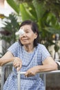 Elderly use eye shield covering after cataract surgery. Royalty Free Stock Photo