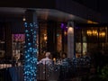 Elderly White Caucasian couple dining al-fresco at Joie vegetarian restaurant, Orchard Central, Orchard Road Singapore