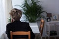 Elderly widow sitting alone Royalty Free Stock Photo