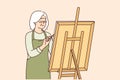 Elderly woman artist stands near easel and draws picture enjoying creative hobby after retiring