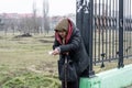 An elderly woman asks for alms near the agricultural market in the city of Tiraspol