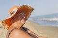 Elderly woman in a bathing suit by the sea. Royalty Free Stock Photo