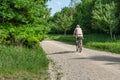 Elderly woman biking in the Perlacher Forst Royalty Free Stock Photo