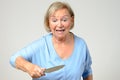 Elderly woman brandishing a kitchen knife