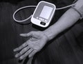 Elderly woman check blood pressure.and heart rate with digital pressure measuring. Black and white tone. Happy aging and Medical Royalty Free Stock Photo