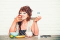 Elderly woman choose apple or pill bottle Royalty Free Stock Photo