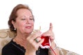 Elderly woman concentrating on her knitting