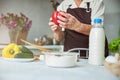 Elderly woman cooking dinner in kitchen at home Royalty Free Stock Photo