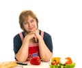 Elderly woman cooks food Royalty Free Stock Photo