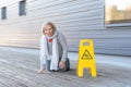 Elderly woman crawling on her knees after slipping