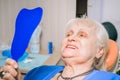 An elderly woman in a dentist`s cross Royalty Free Stock Photo