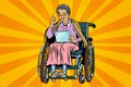 Elderly woman disabled person in a wheelchair, gadget tablet