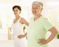 Elderly woman doing exercises with trainer Royalty Free Stock Photo