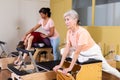 Elderly woman doing exercises on wunda chair in pilates studio Royalty Free Stock Photo