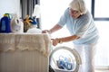 Elderly woman doing a laundry Royalty Free Stock Photo