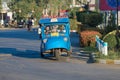 Elderly woman driver on a retro tuk-tuk. Sukhothai