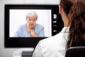 Elderly Woman with dyspnea, Doctor looking at the desk, telemedicine and telehealth with live chat