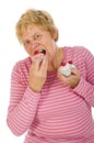 Elderly woman is eating Royalty Free Stock Photo