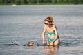 Elderly woman enjoying outdoor activities playing ball in river swimming with her cute dog Dachshund breed. concept pets, love for Royalty Free Stock Photo