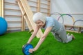 Elderly woman exercising in a rehabilitation center Royalty Free Stock Photo