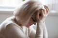 Elderly woman feeling unwell suffering from pain or dizziness Royalty Free Stock Photo