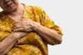 Elderly woman feels pain in her chest. Senior female Asian suffering from bad pain in his chest heart attack. Concept of emergency Royalty Free Stock Photo