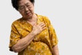 Elderly woman feels pain in her chest. Senior female Asian suffering from bad pain in his chest heart attack. Concept of emergency Royalty Free Stock Photo