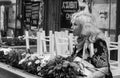 Elderly woman and flowers