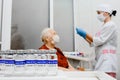 Elderly woman getting coronavirus vaccine. Vaccines for the elderly