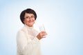 Elderly woman with glass of water