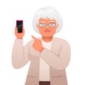 Elderly woman with glasses points to the phone in her hand. Old gray-haired grandmother advertises an application in a smartphone