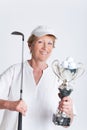 Elderly woman with a golf trophy Royalty Free Stock Photo