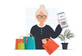 An elderly woman, grandmother doing online purchase with smartphone, online shopping concept, domestic life concept