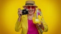 Elderly woman grandmother tourist photographer taking photos on camera, travel, holiday vacations Royalty Free Stock Photo