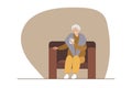 Elderly woman with gray hair sitting in armchair and taking hot drink. Senior woman wearing warm clothes, warm winter