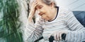 Elderly woman having headache, geometric pattern