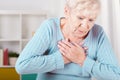 Elderly woman having heart attack Royalty Free Stock Photo