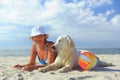 Elderly woman with her golder retriever on a sea Royalty Free Stock Photo