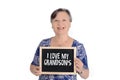 Elderly woman holding chalkboard with text Royalty Free Stock Photo