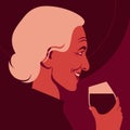 The elderly woman is holding the glass of the red wine. Profile of the sommelier.