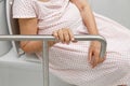 Elderly woman holding on handrail in toilet. Royalty Free Stock Photo