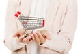 Elderly woman holding small trolley