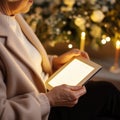 An elderly woman holding a tablet computer with candles in the background, AI Royalty Free Stock Photo