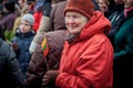 Elderly woman holds the Lithuanian flag