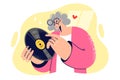 Elderly woman holds vinyl record for listening to music on gramophone and collects sound recordings