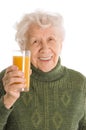 Elderly woman with a juice glass