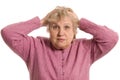 The elderly woman keeps for a head Royalty Free Stock Photo